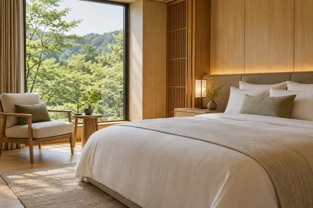 A quiet hotel room with soft light and linen