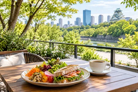 An illustrative sandwich and coffee lunch at a cafe overlooking greenery