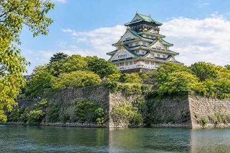 An illustrative exterior view of Osaka Castle and its stone walls
