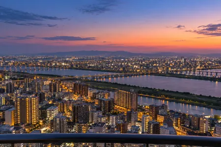 An illustrative view of the Yodo River and Osaka lights from the Floating Garden Observatory