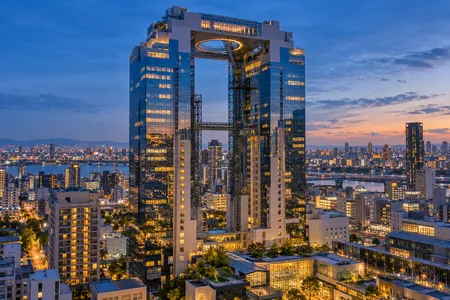 An illustrative sightseeing view of Umeda Sky Building and Osaka at night